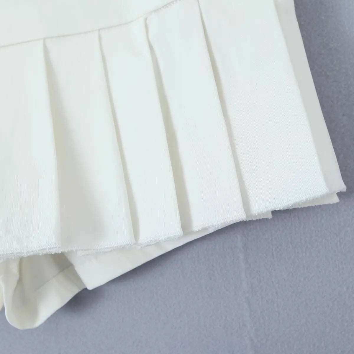 YENKYE 2023 Cool Girl Y2K American Retro Pleated Mini Skirt Sexy Low Waist Side Button Women Summer Skirts With Shorts Lining